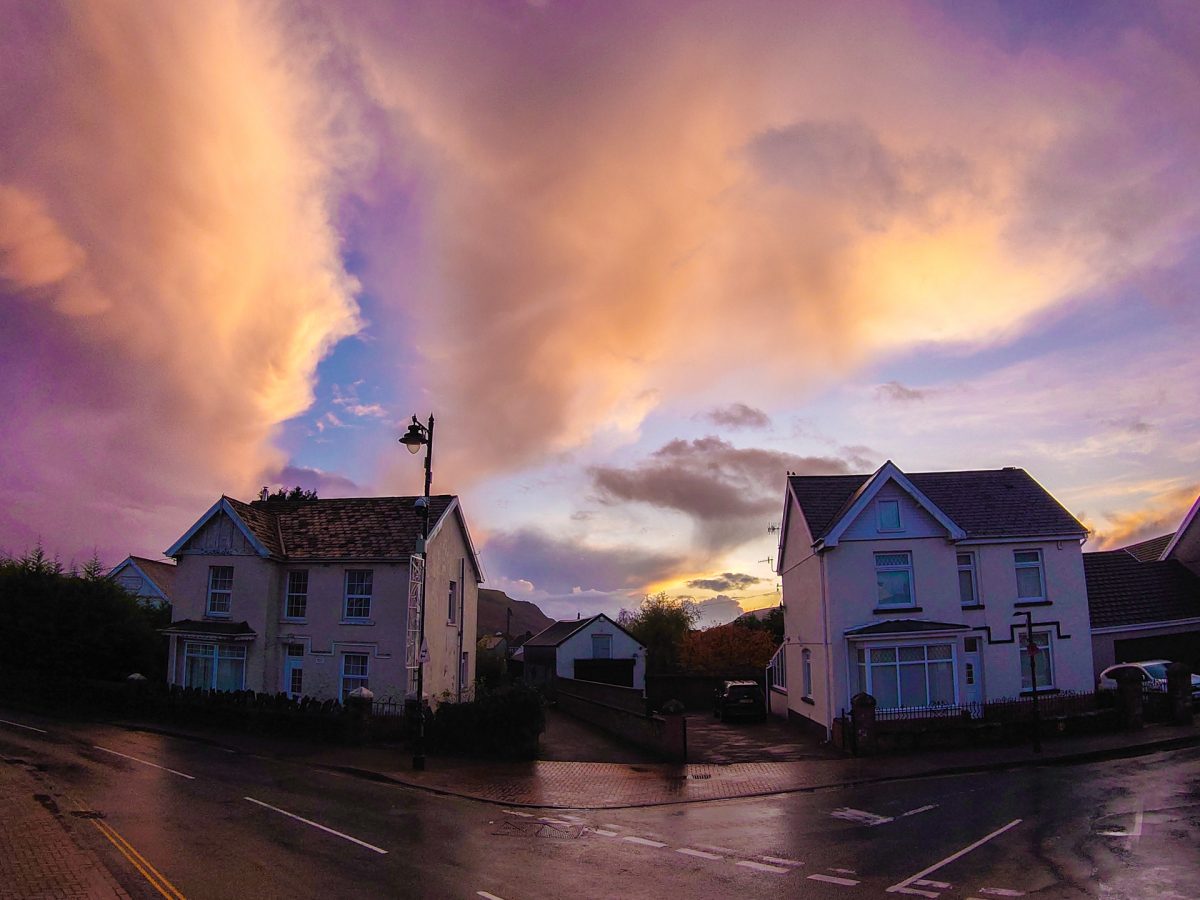 Sunset behind two traditional detached houses on Station Road, Ystradgynlais