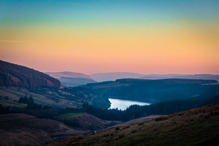 Looking down on Cantref Reservoir in the Brecon Beacons at sunset in late winter