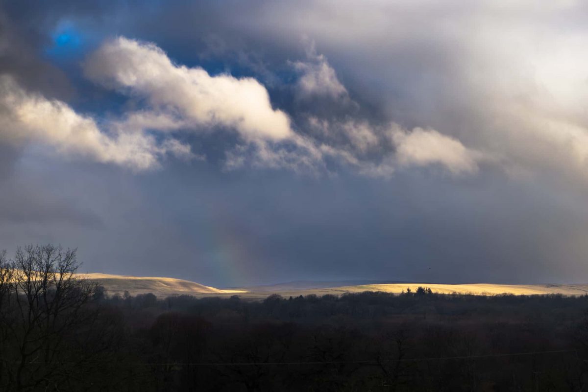 Stormy rain and sunlight over the Brecon Beacons.