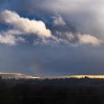 Stormy rain and sunlight over the Brecon Beacons.
